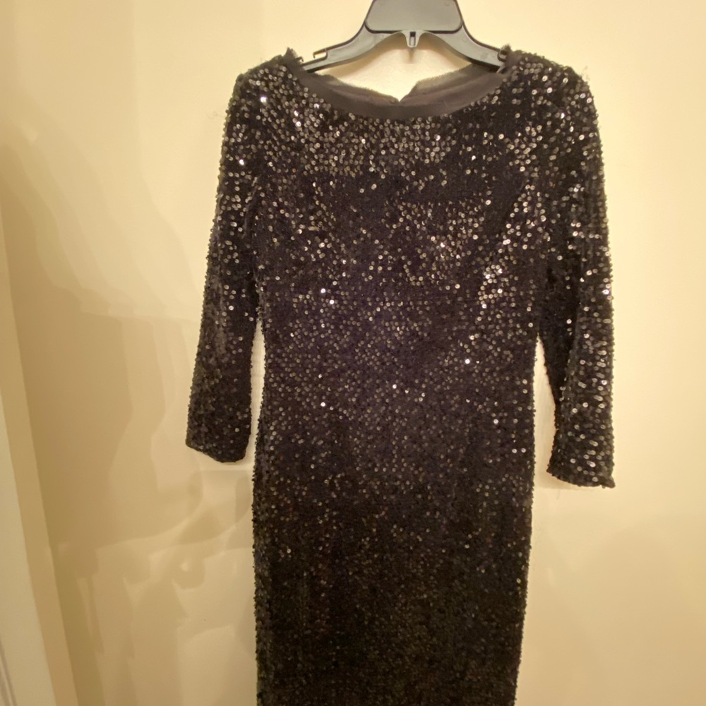 Beautiful black sequins semi formal tee length gown with key hole back.